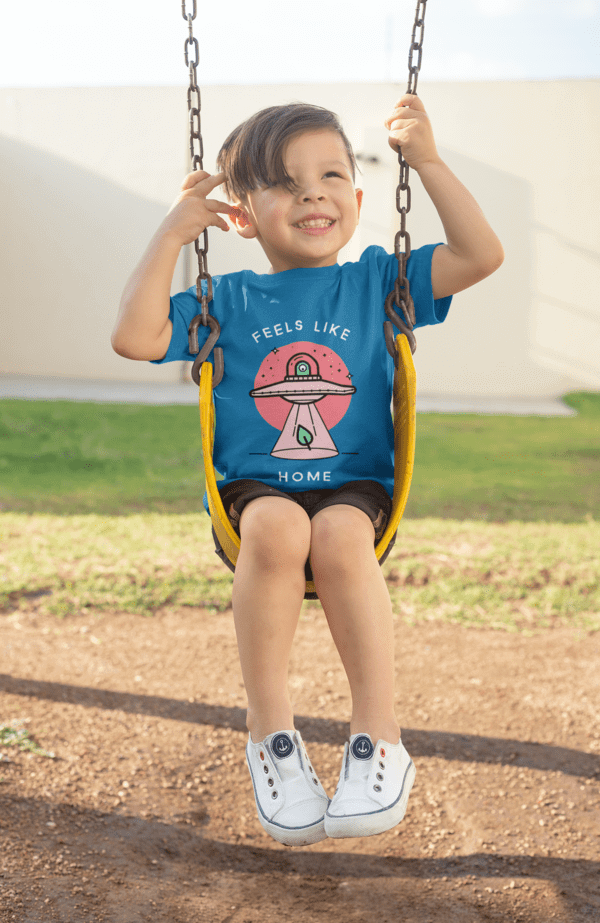 T Shirt Mockup Of A Boy Playing On A Swing Min